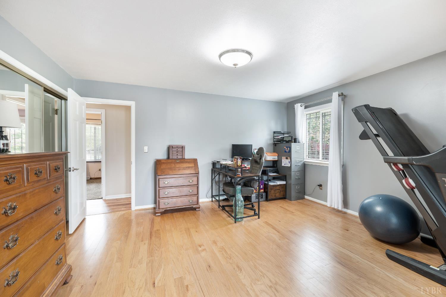 192 Liberty Chapel Road Appomattox, VA 24522 - Photo 30 of 60 a view of a workspace with furniture and a wooden floor