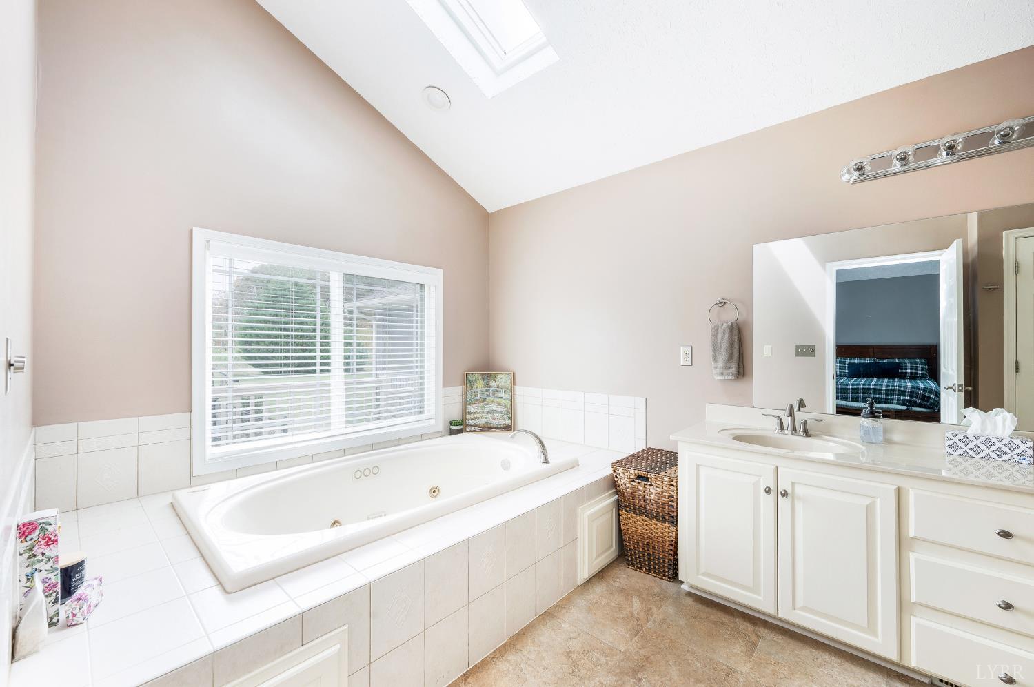 192 Liberty Chapel Road Appomattox, VA 24522 - Photo 33 of 60 a bathroom with a tub sink and mirror