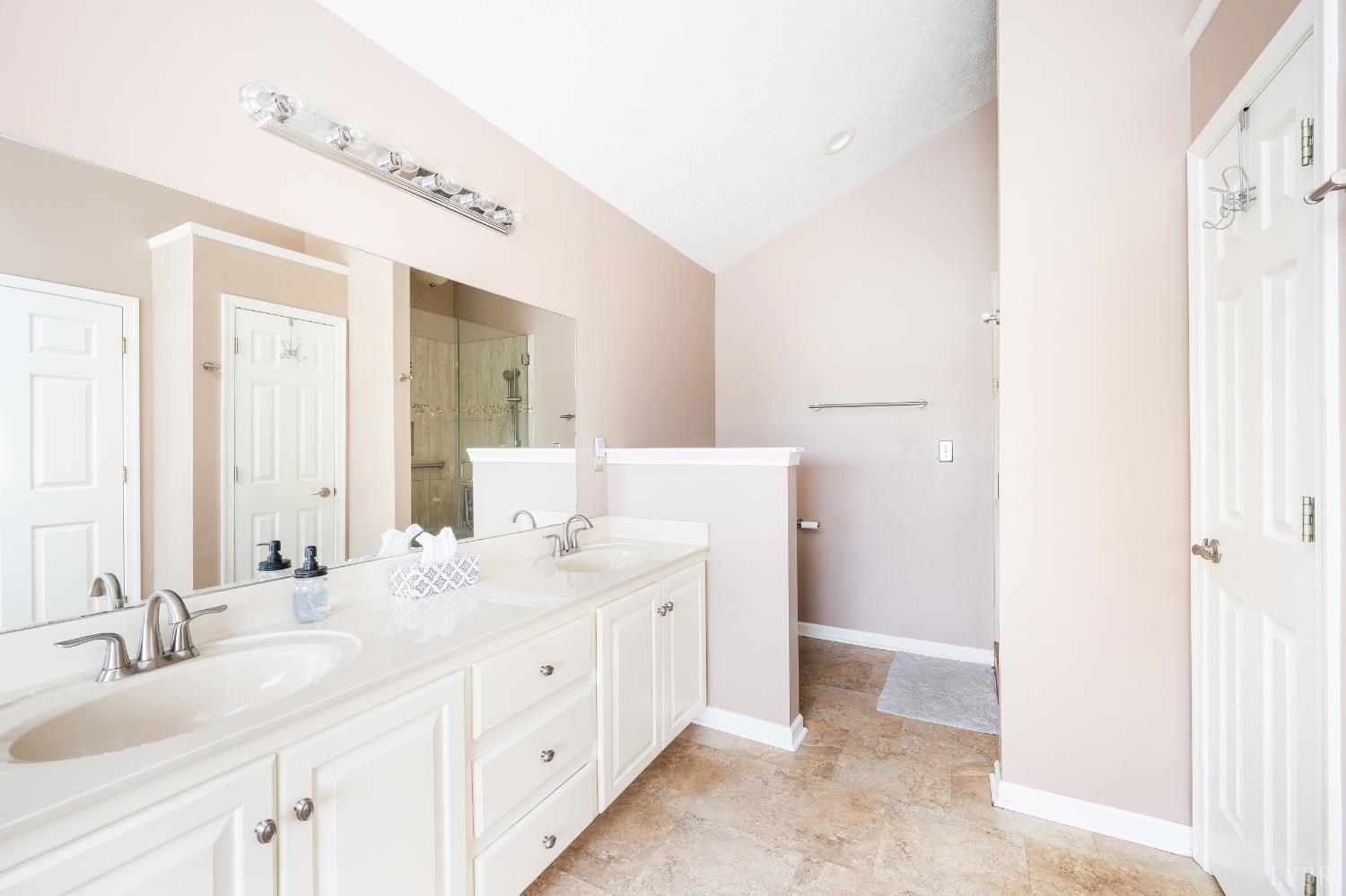 192 Liberty Chapel Road Appomattox, VA 24522 - Photo 35 of 60 a spacious bathroom with a double vanity sink and a mirror