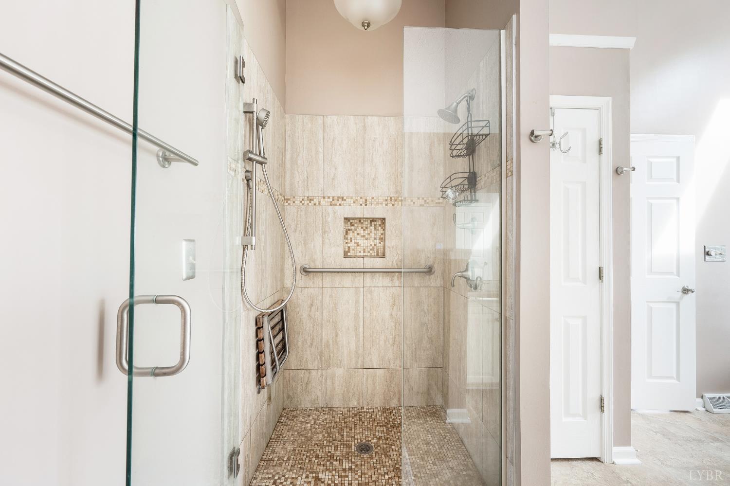 192 Liberty Chapel Road Appomattox, VA 24522 - Photo 36 of 60 a bathroom with a shower and a mirror