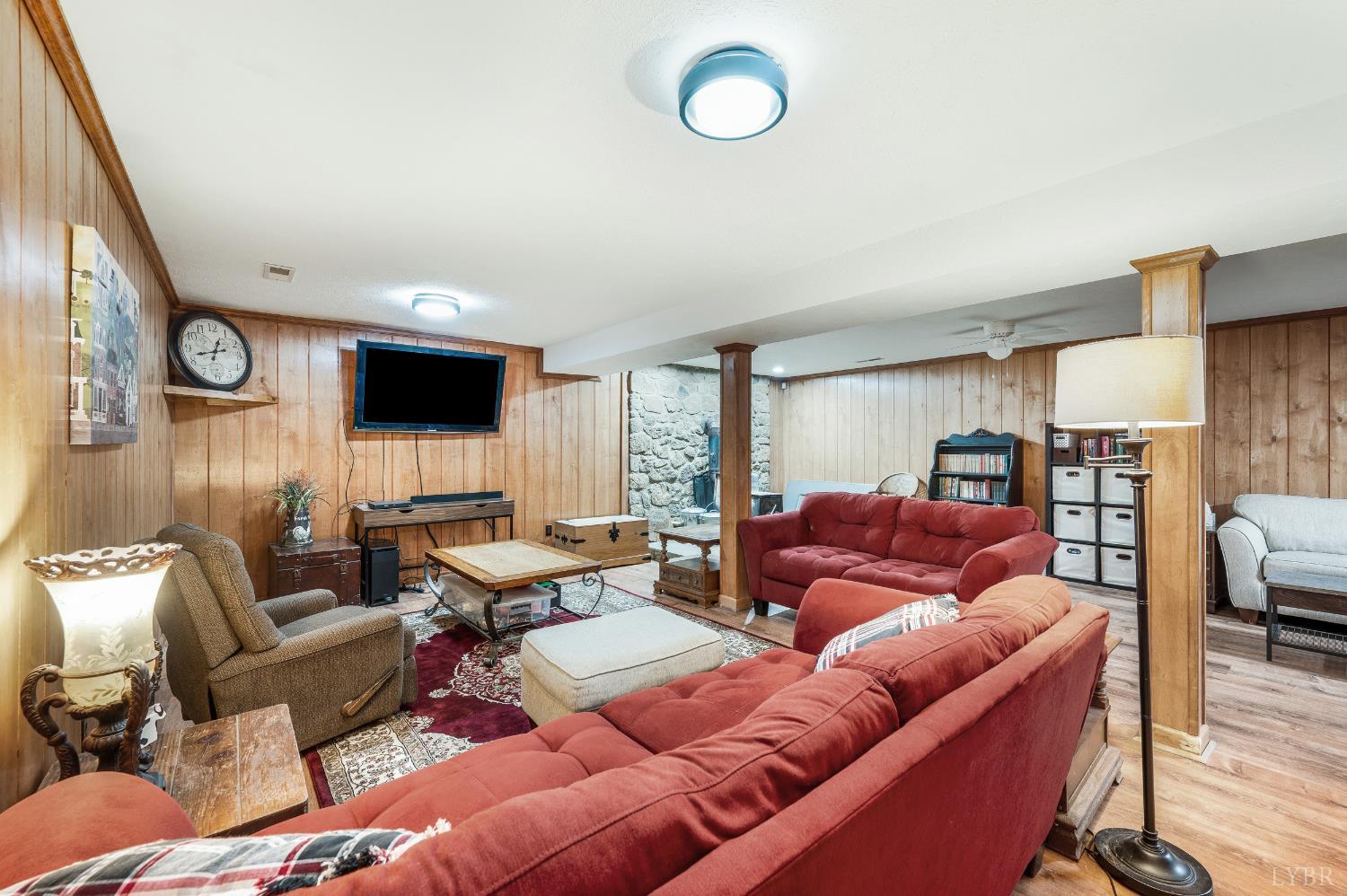 192 Liberty Chapel Road Appomattox, VA 24522 - Photo 40 of 60 a living room with furniture and a flat screen tv