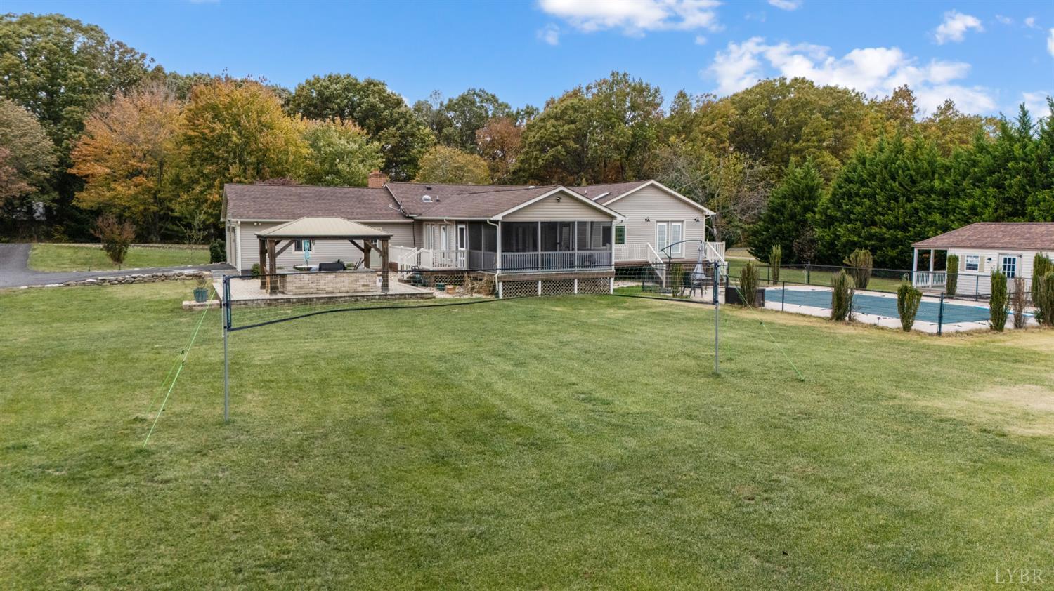192 Liberty Chapel Road Appomattox, VA 24522 - Photo 45 of 60 a view of a house with a big yard and large trees