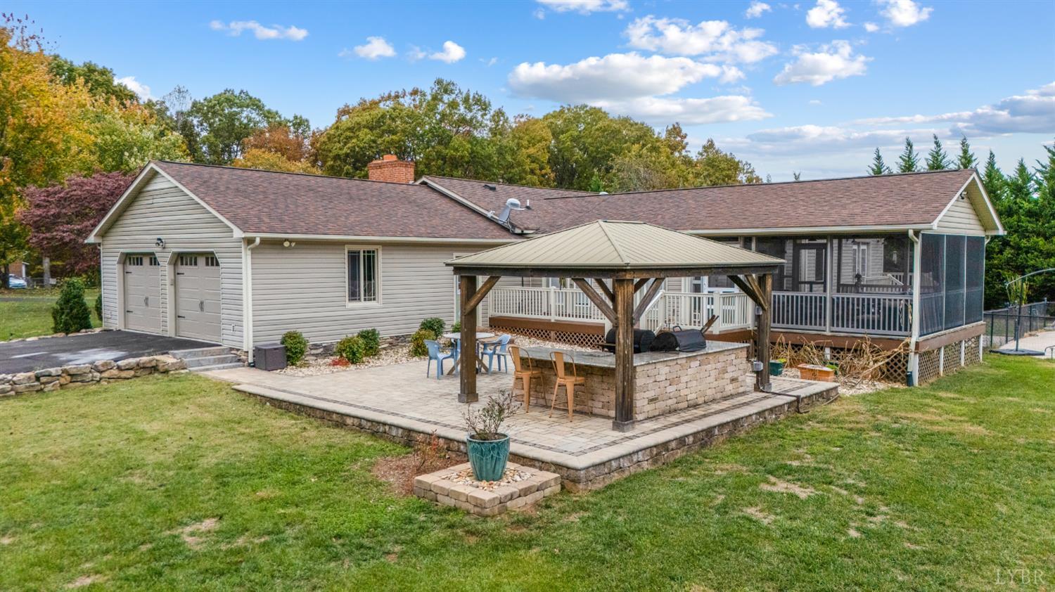 192 Liberty Chapel Road Appomattox, VA 24522 - Photo 7 of 60 a white house that has a tree in it