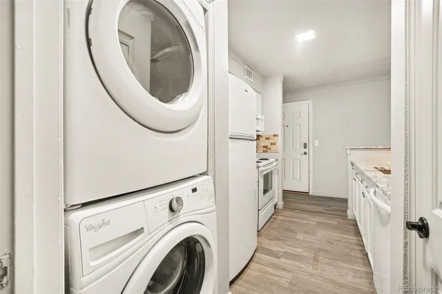 a view of a kitchen with washer and dryer