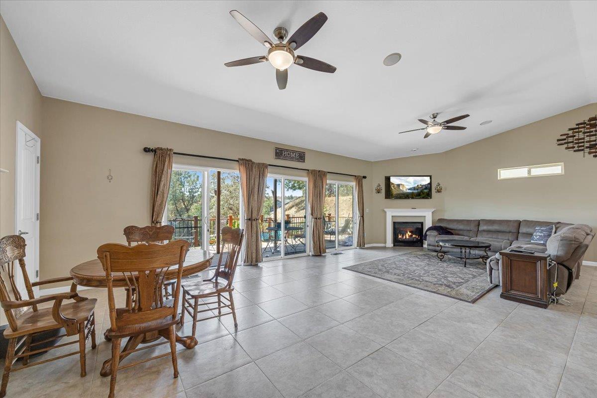 411 Sunrise Road Copperopolis, CA 95228 - Photo 8 of 76 Actual furnishings. HUGE great room with great natural light, large easy-care porcelain tile, ceiling fans, and more!