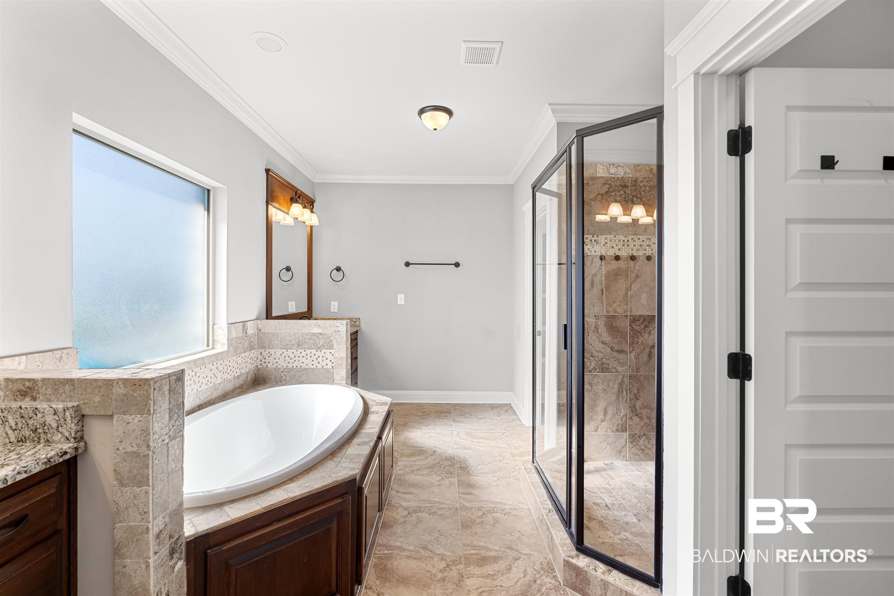 8844 Rosedown Lane Daphne, AL 36526 - Photo 11 of 24 Full bathroom with a shower stall, vanity, ornamental molding, and a garden tub