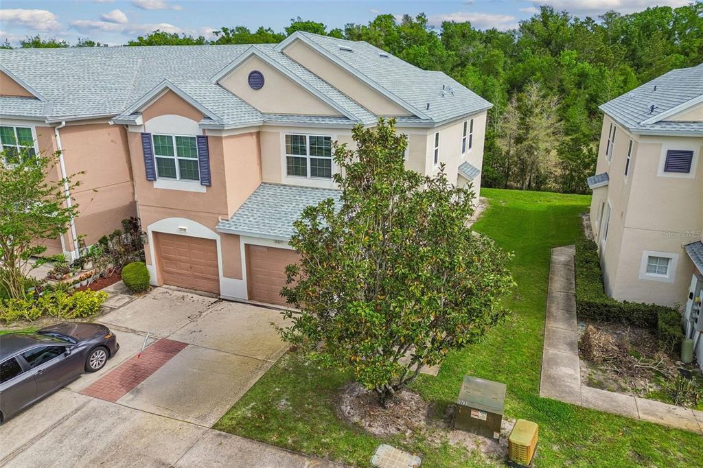 a aerial view of a house with a yard