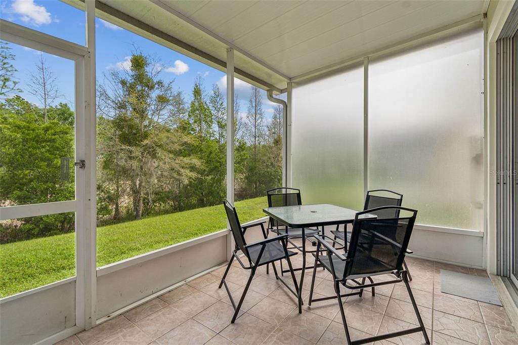 26527 Castleview Way Wesley Chapel, FL 33544 - Photo 14 of 45 a view of a porch with furniture and yard