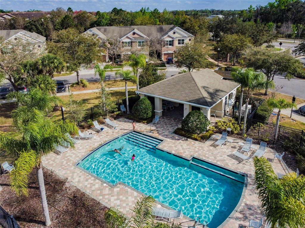 26527 Castleview Way Wesley Chapel, FL 33544 - Photo 26 of 45 an aerial view of a house with a garden and lake view