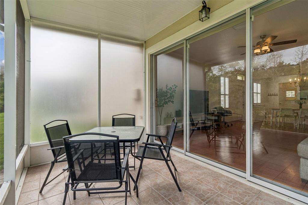 26527 Castleview Way Wesley Chapel, FL 33544 - Photo 27 of 45 a view of a room with a dining table and chairs