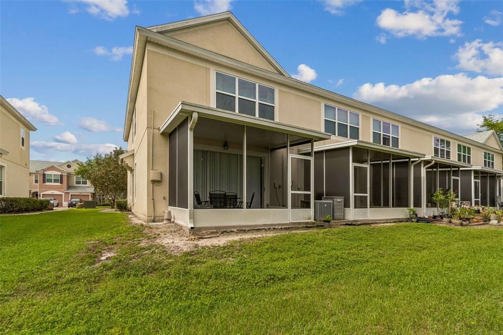 26527 Castleview Way Wesley Chapel, FL 33544 - Photo 34 of 45 a front view of a house with a yard