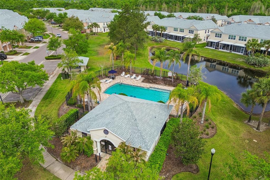 26527 Castleview Way Wesley Chapel, FL 33544 - Photo 38 of 45 an aerial view of residential houses with outdoor space and swimming pool