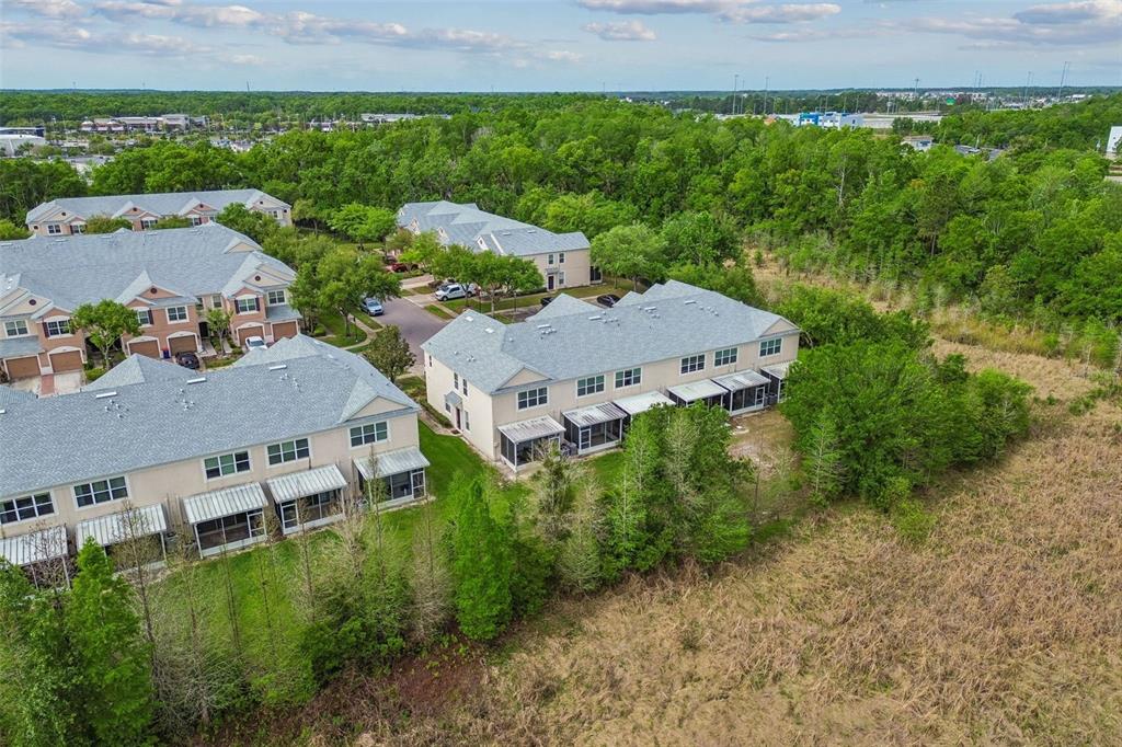 26527 Castleview Way Wesley Chapel, FL 33544 - Photo 4 of 45 an aerial view of multiple house