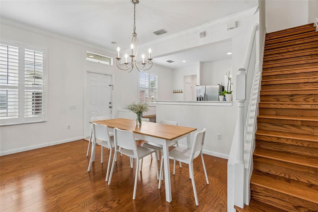 26527 Castleview Way Wesley Chapel, FL 33544 - Photo 6 of 45 a view of a dining room with furniture and wooden floor