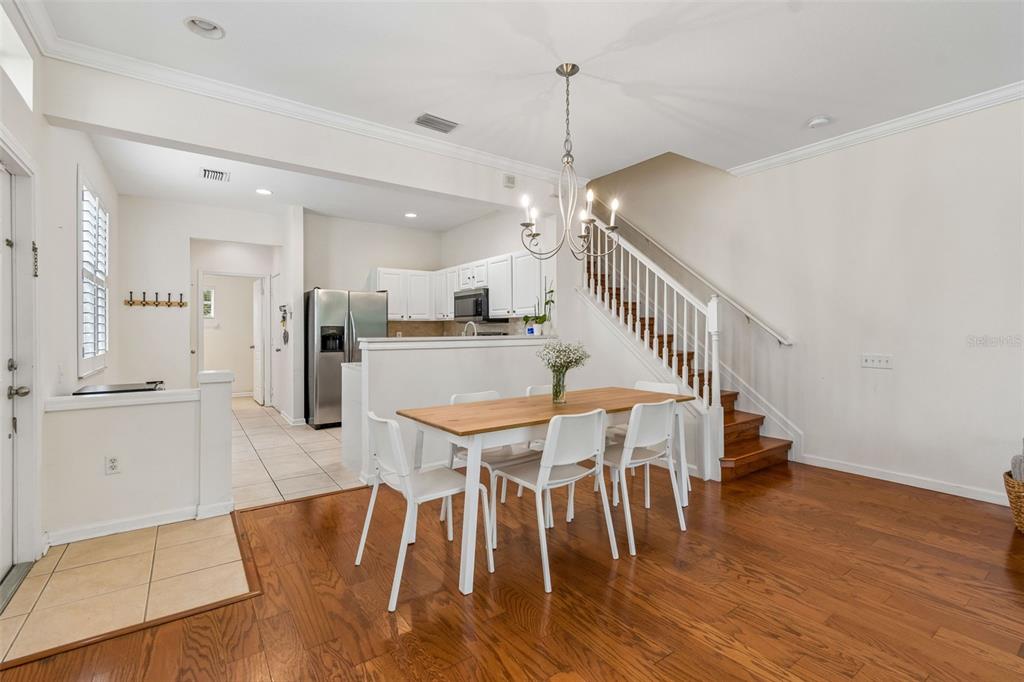 26527 Castleview Way Wesley Chapel, FL 33544 - Photo 10 of 45 a dining room with furniture and wooden floor