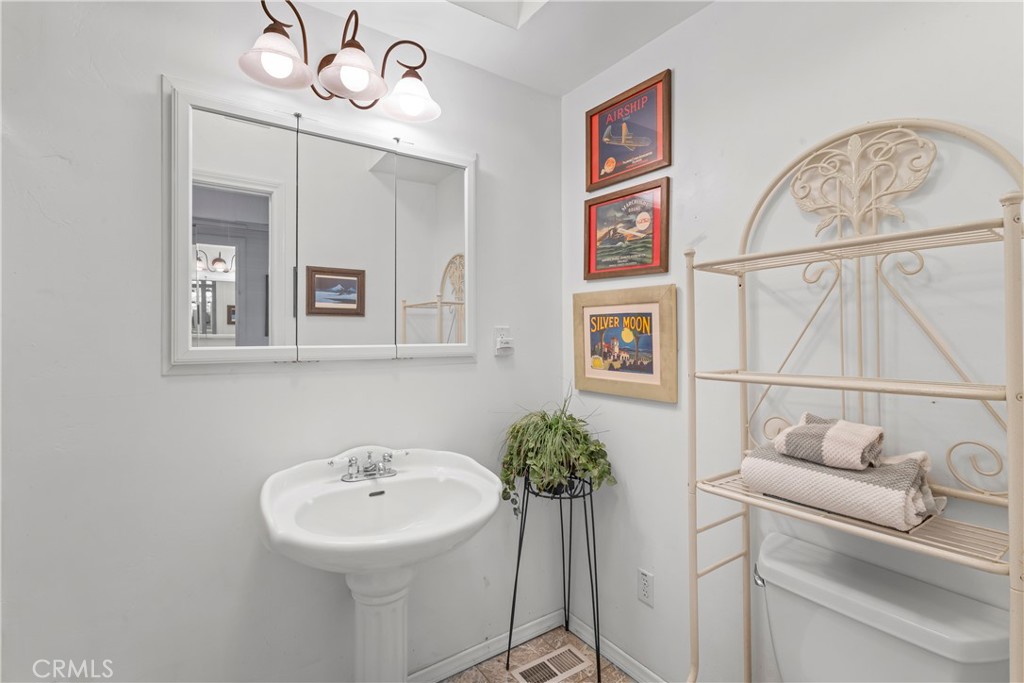 705 Cypress Road Cedar Glen, CA 92321 - Photo 17 of 51 a bathroom with a sink and a mirror