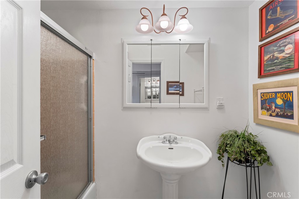 705 Cypress Road Cedar Glen, CA 92321 - Photo 18 of 51 a bathroom with a sink and a mirror