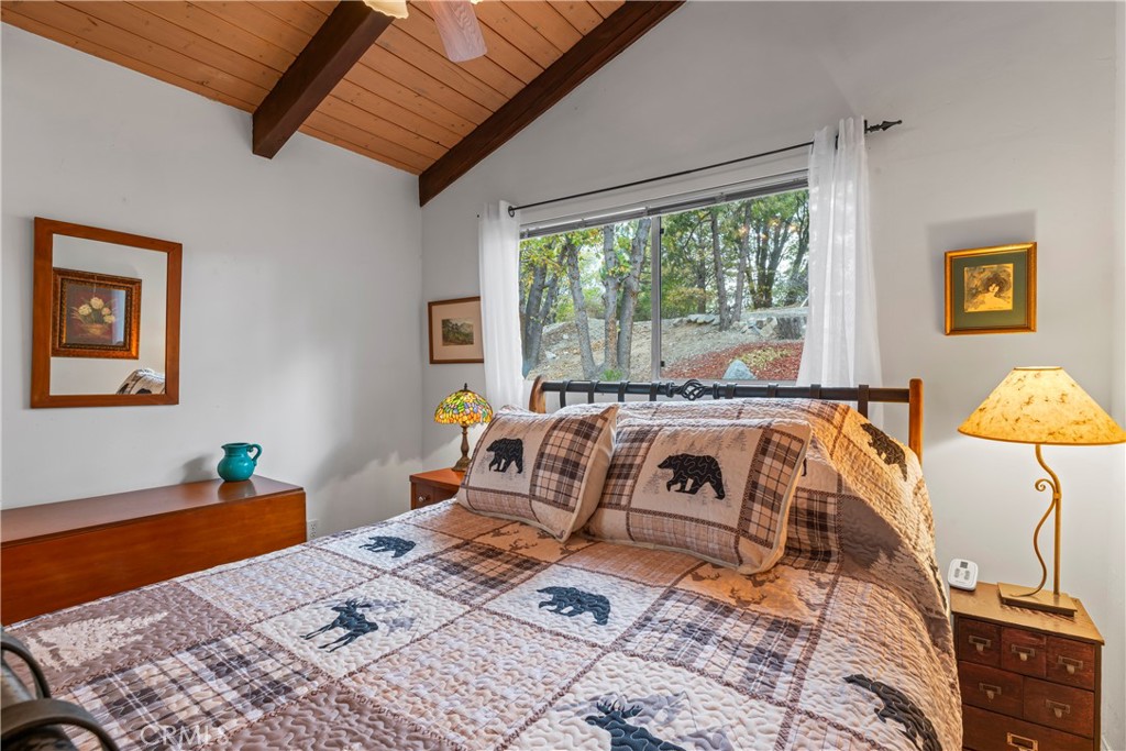 705 Cypress Road Cedar Glen, CA 92321 - Photo 20 of 51 a bedroom with furniture and a window