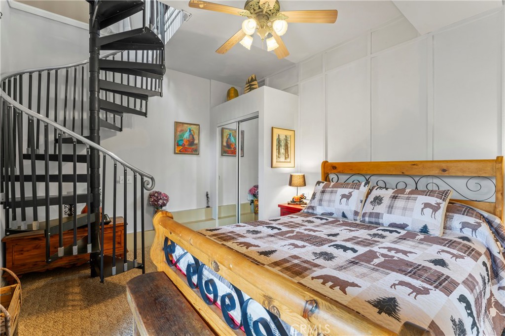 705 Cypress Road Cedar Glen, CA 92321 - Photo 24 of 51 a bedroom with a bed and a table in it