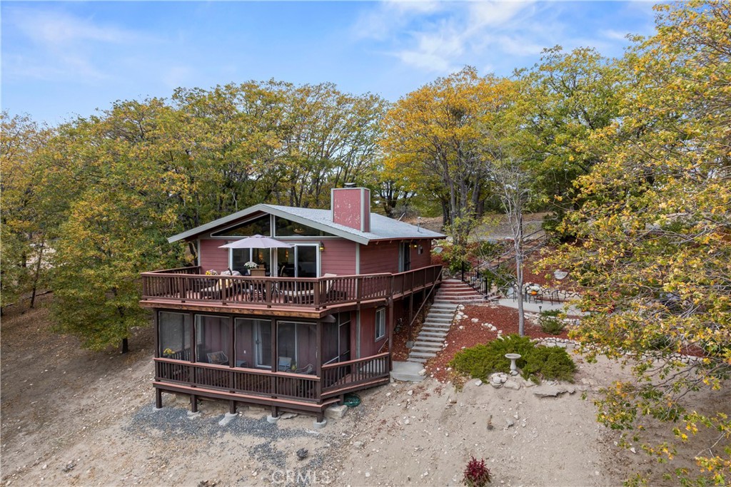705 Cypress Road Cedar Glen, CA 92321 - Photo 33 of 51 a view of a wooden house with a yard
