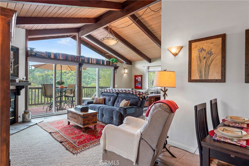 705 Cypress Road Cedar Glen, CA 92321 - Photo 8 of 51 a living room with furniture a rug and a floor to ceiling window