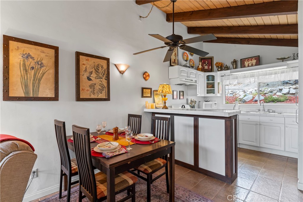 705 Cypress Road Cedar Glen, CA 92321 - Photo 9 of 51 a dining room with a table and chairs