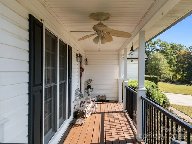 a view of a balcony with wooden floor