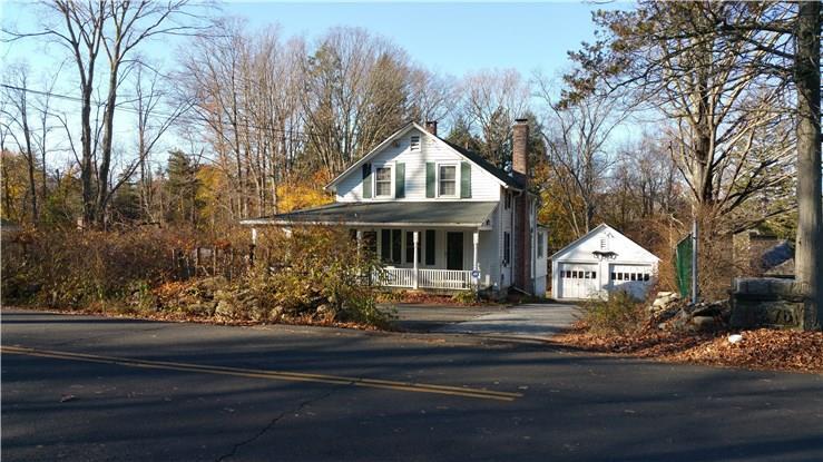 272 Den Road Stamford, CT 06903 - Photo 1 of 1 a front view of house with trees around