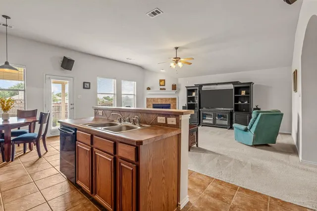 a kitchen with a stove and a refrigerator