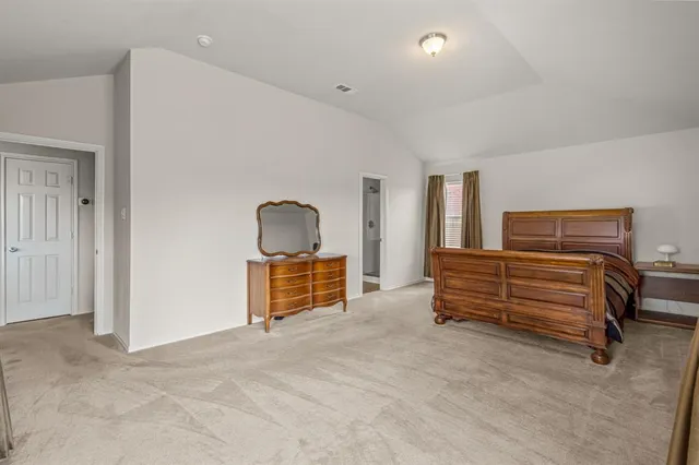 a view of room with stairs and furniture