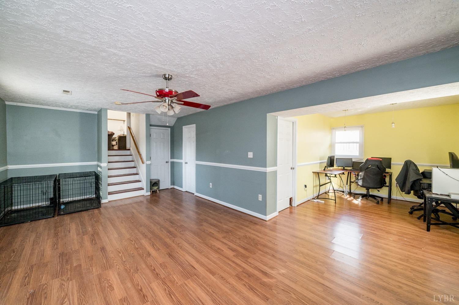 2271 Sunburst Road Evington, VA 24550 - Photo 18 of 26 a view of a livingroom with wooden floor and furniture