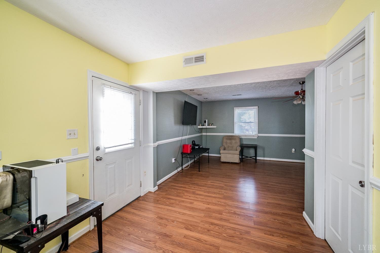 2271 Sunburst Road Evington, VA 24550 - Photo 19 of 26 wooden floor and chair in a room