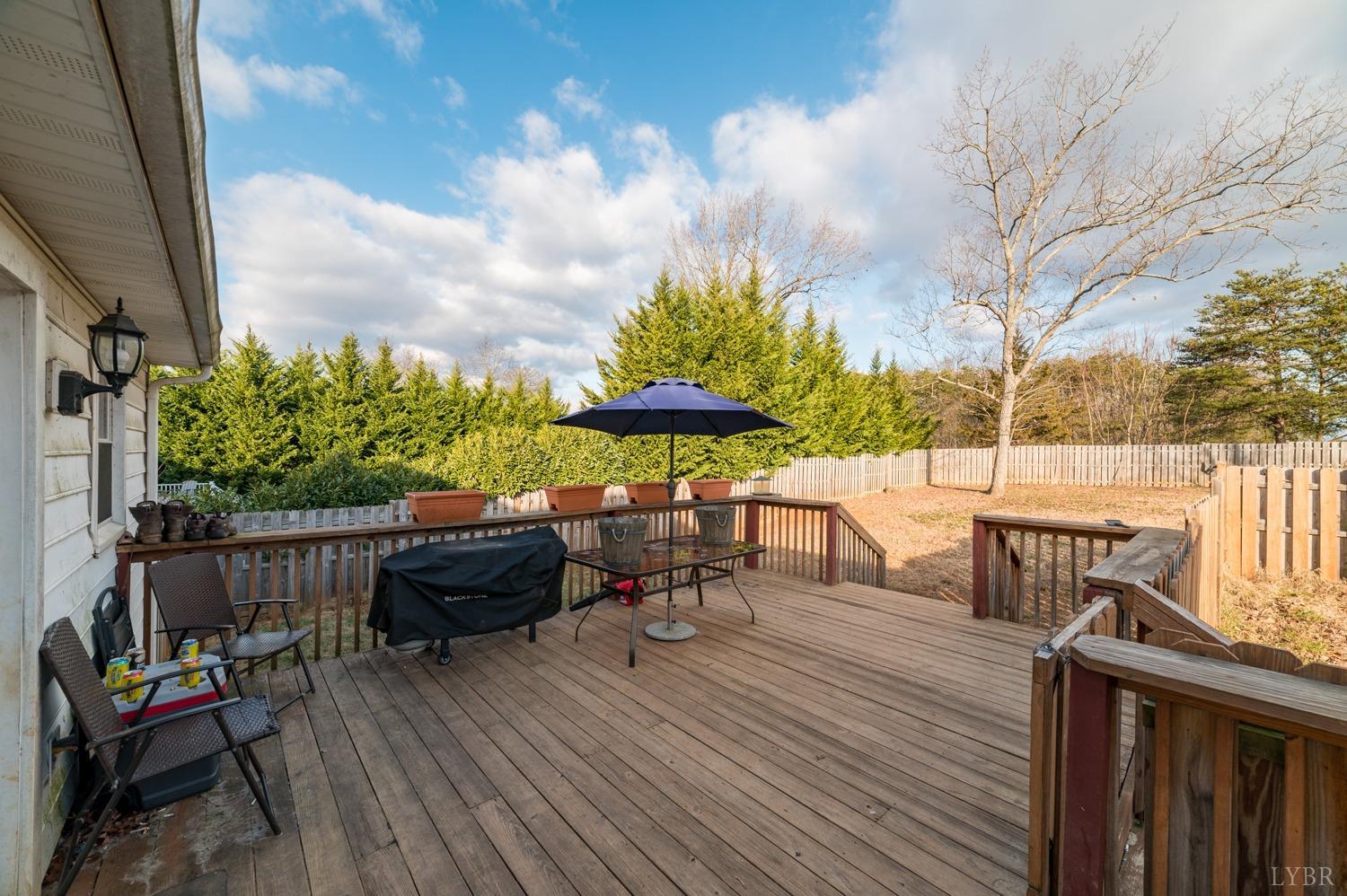2271 Sunburst Road Evington, VA 24550 - Photo 24 of 26 a view of a chairs and table on the wooden floor