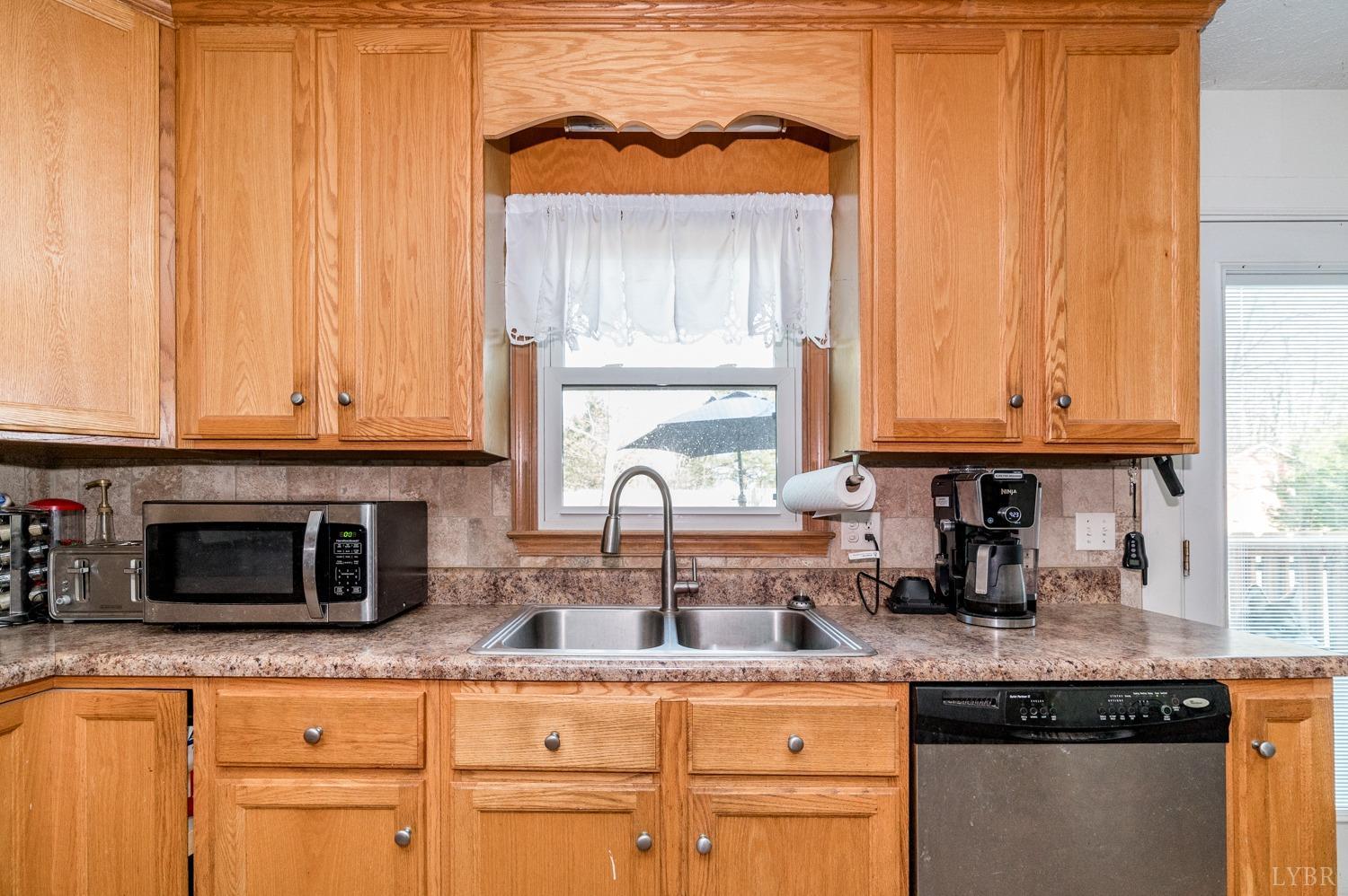 2271 Sunburst Road Evington, VA 24550 - Photo 6 of 26 a kitchen with stainless steel appliances granite countertop a sink and a cabinets