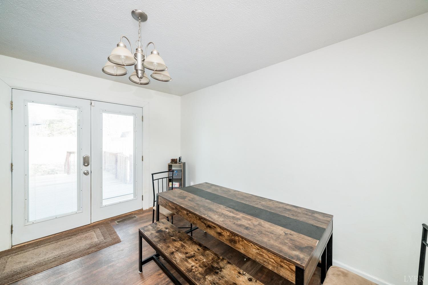 2271 Sunburst Road Evington, VA 24550 - Photo 8 of 26 a view of a room with a wooden floor