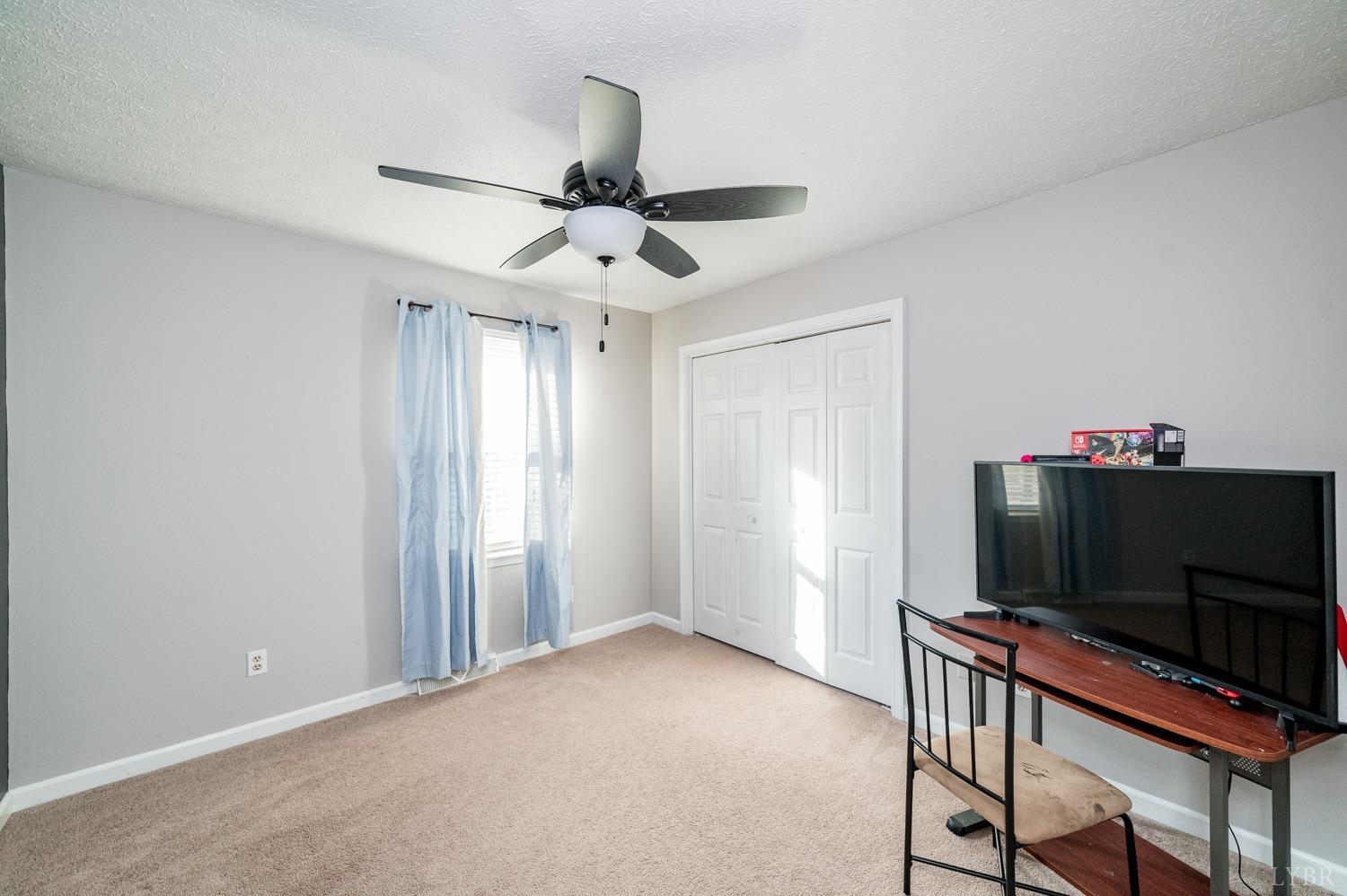2271 Sunburst Road Evington, VA 24550 - Photo 10 of 26 a living room with furniture and a flat screen tv