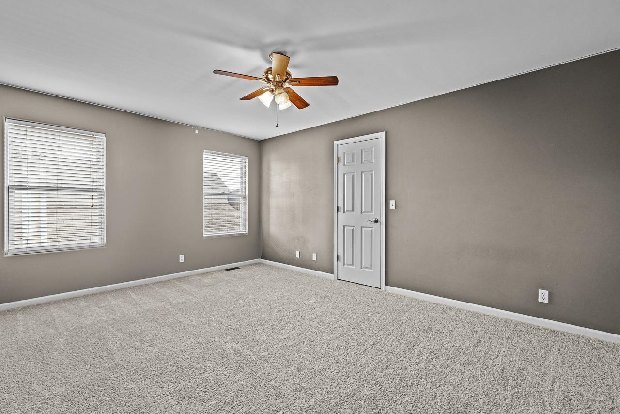 217 Market Street Genoa, IL 60135 - Photo 13 of 32 a view of an empty room with a window