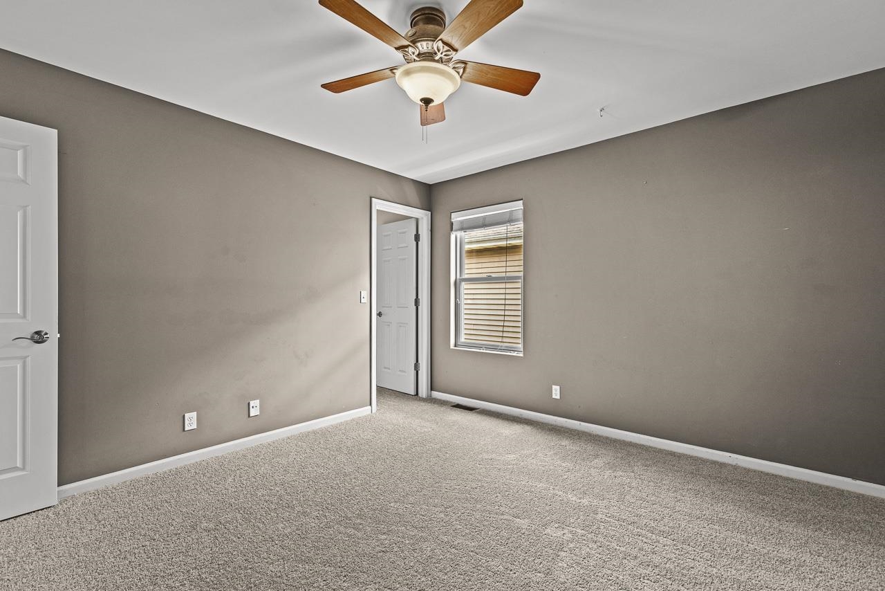 217 Market Street Genoa, IL 60135 - Photo 14 of 32 a view of an empty room with a window