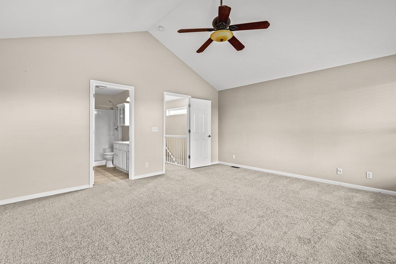 217 Market Street Genoa, IL 60135 - Photo 16 of 32 an empty room with chandelier fan and windows