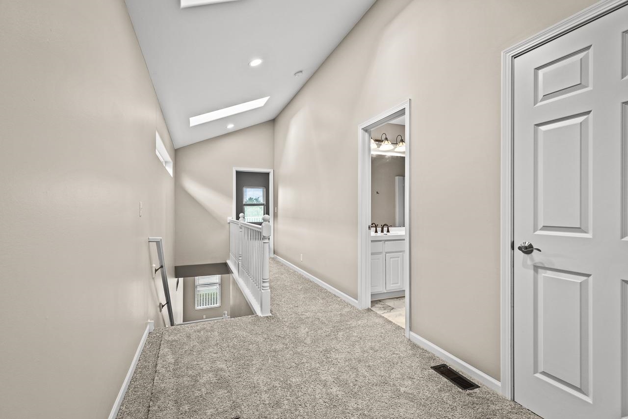 217 Market Street Genoa, IL 60135 - Photo 19 of 32 wooden floor in a hall with wooden floor and a bathroom