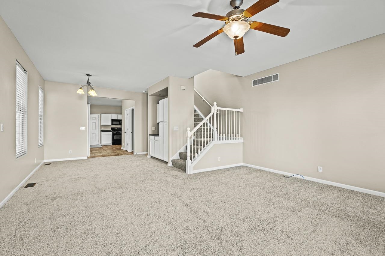 217 Market Street Genoa, IL 60135 - Photo 2 of 32 a view of empty room with ceiling fan