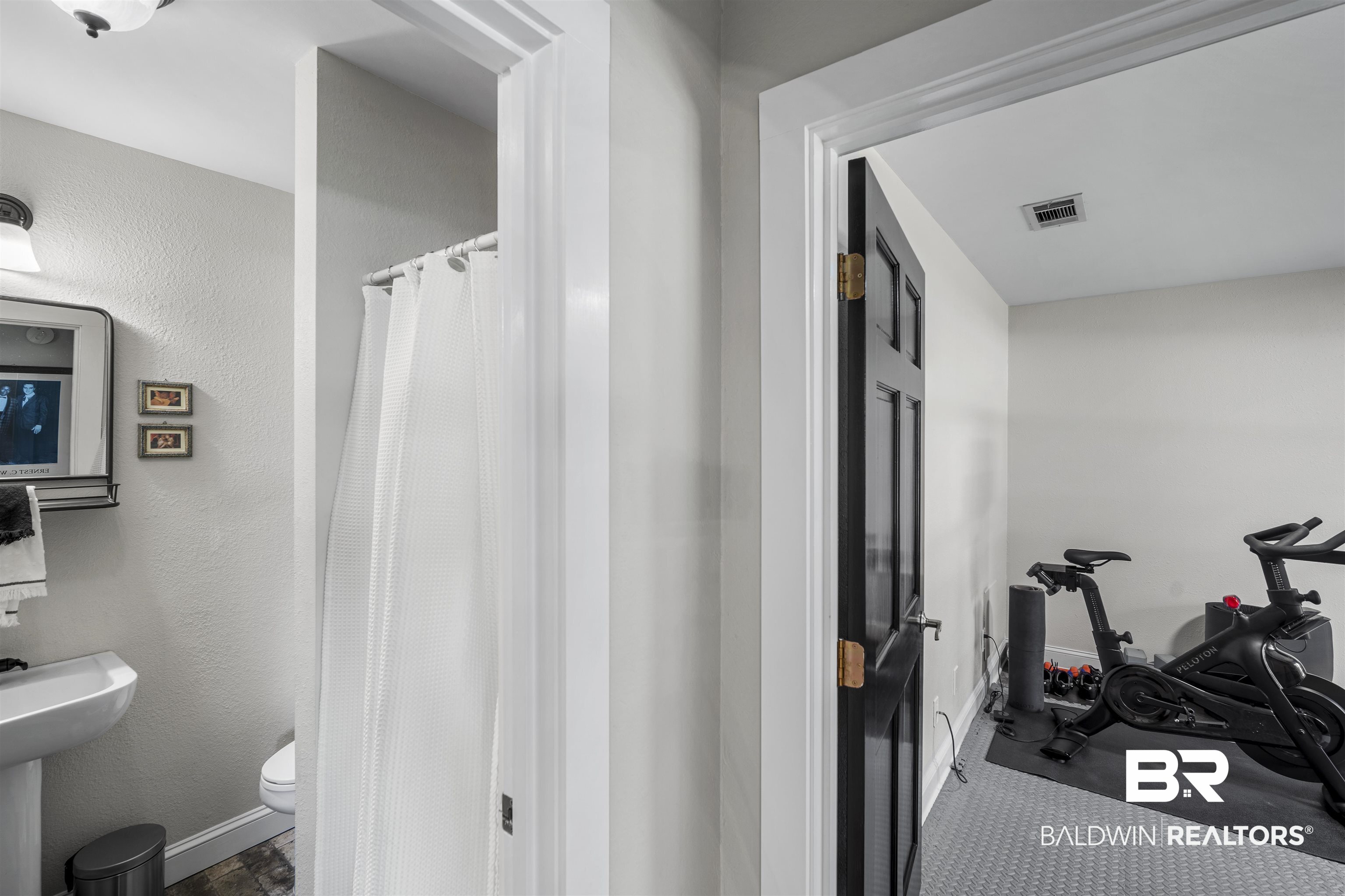 1615 5th Street Daphne, AL 36526 - Photo 13 of 28 Pedestal sink with mirror and mounted light fixture, half bath off great room and 4th bedroom