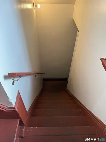a kitchen with a refrigerator a sink and cabinets
