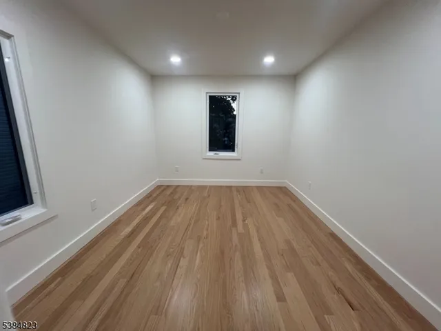 a view of wooden floor in an empty room