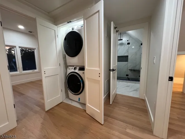 a view of a hallway with washer and dryer