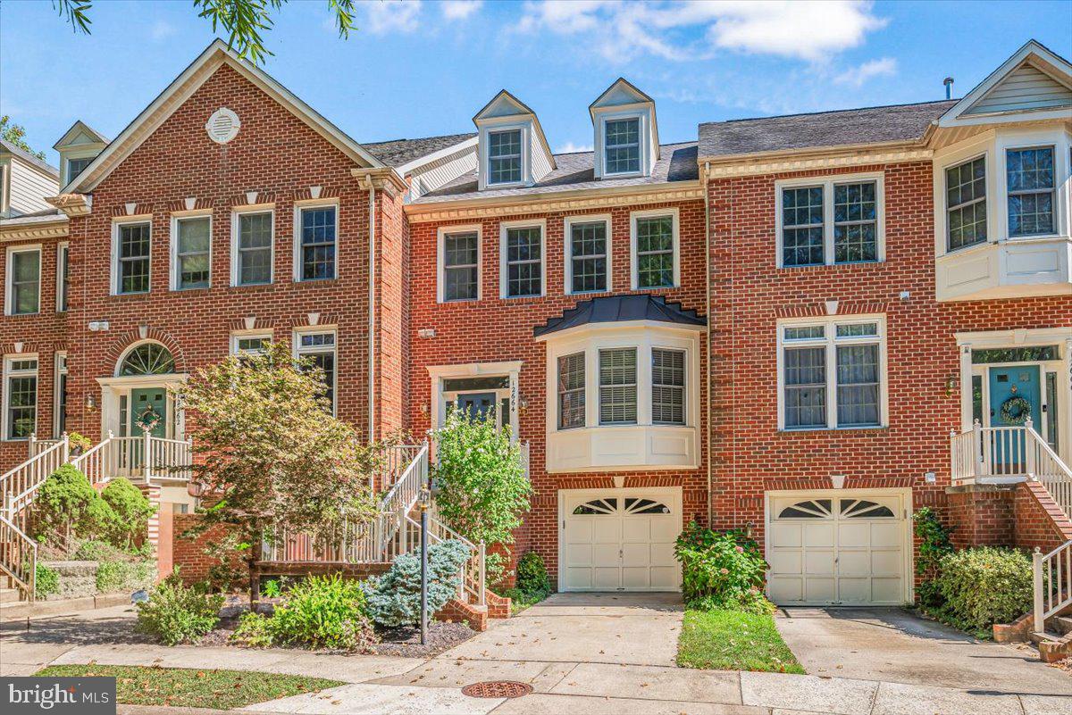 12664 Granite Ridge Drive North Potomac, MD 20878 - Photo 2 of 37 a front view of a house with a yard