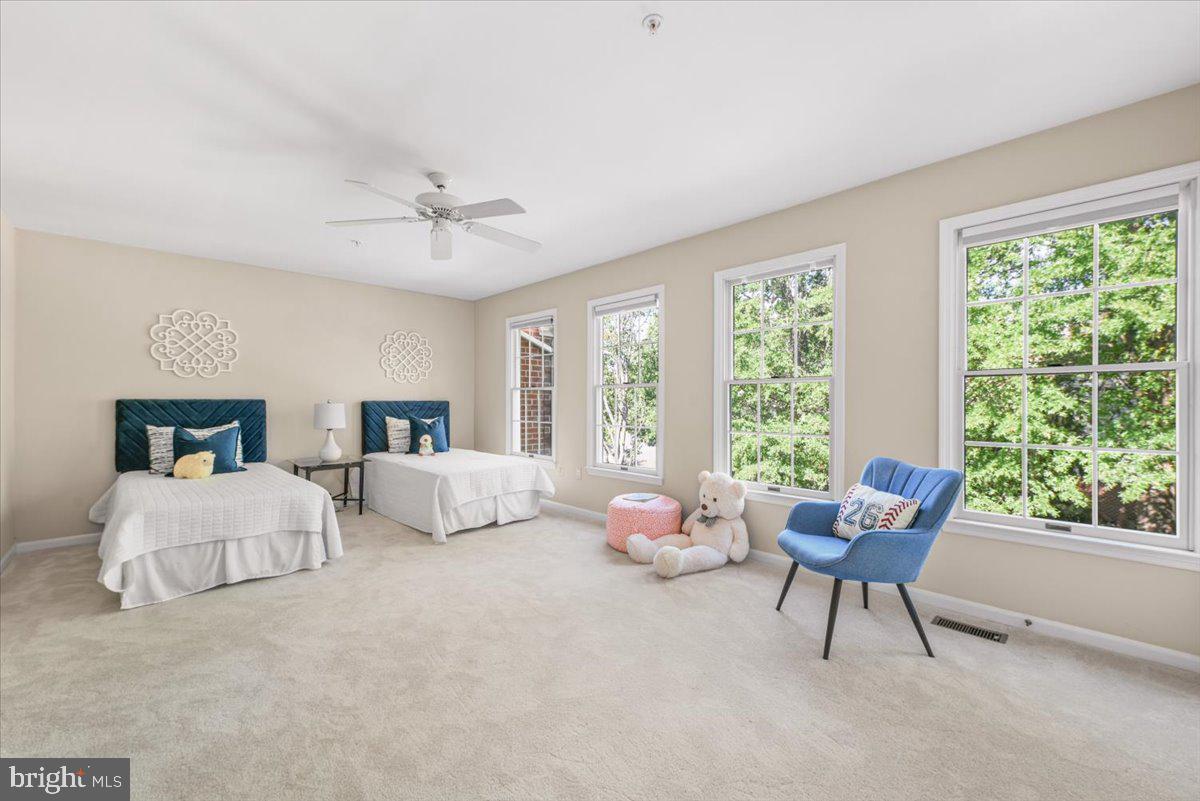 12664 Granite Ridge Drive North Potomac, MD 20878 - Photo 22 of 37 a bedroom with two beds and a large window