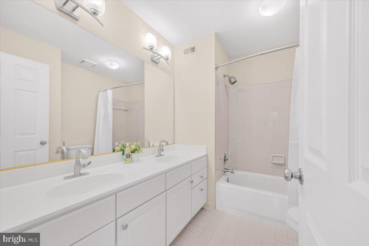 12664 Granite Ridge Drive North Potomac, MD 20878 - Photo 23 of 37 a bathroom with a double vanity sink mirror double and bathtub