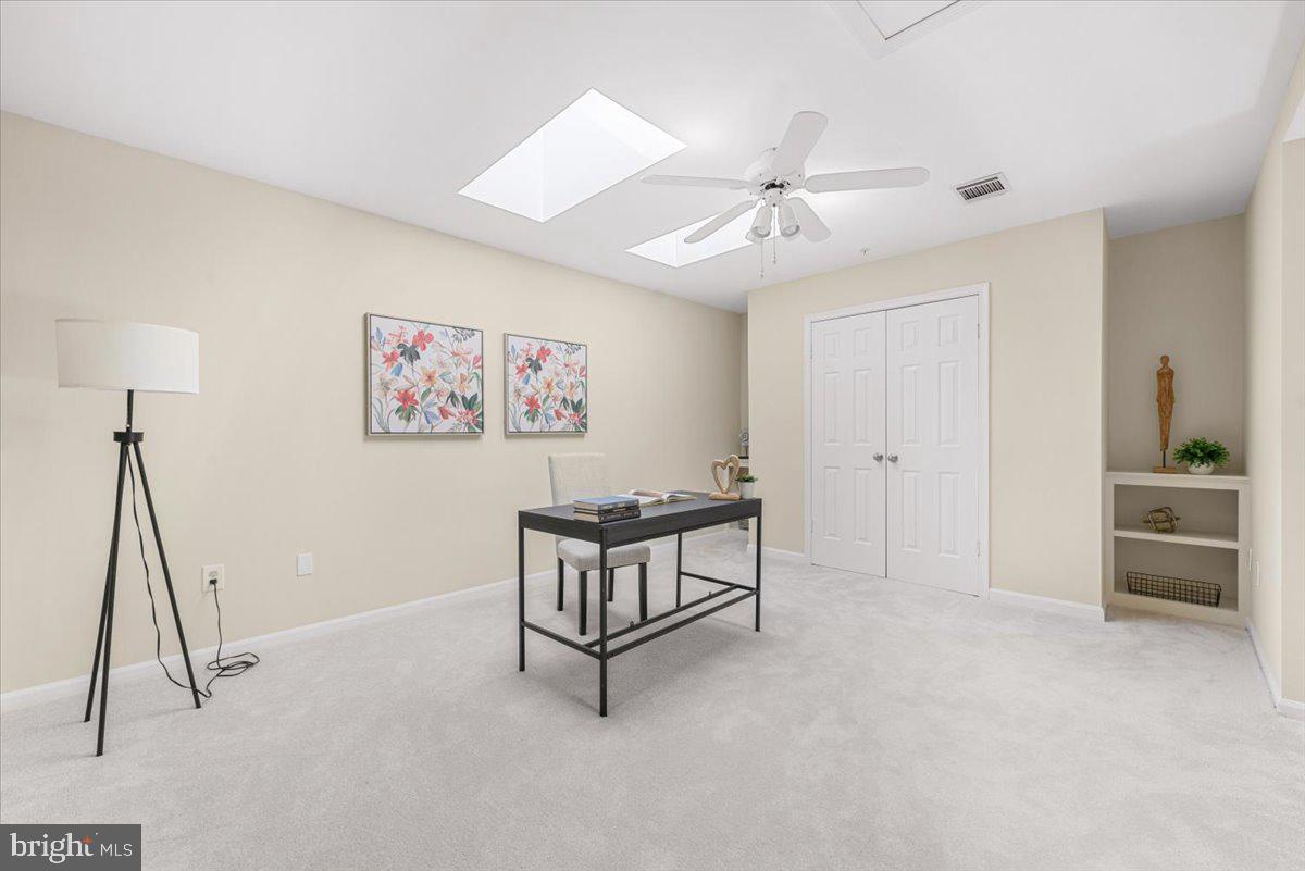 12664 Granite Ridge Drive North Potomac, MD 20878 - Photo 26 of 37 a living room with furniture and a ceiling fan