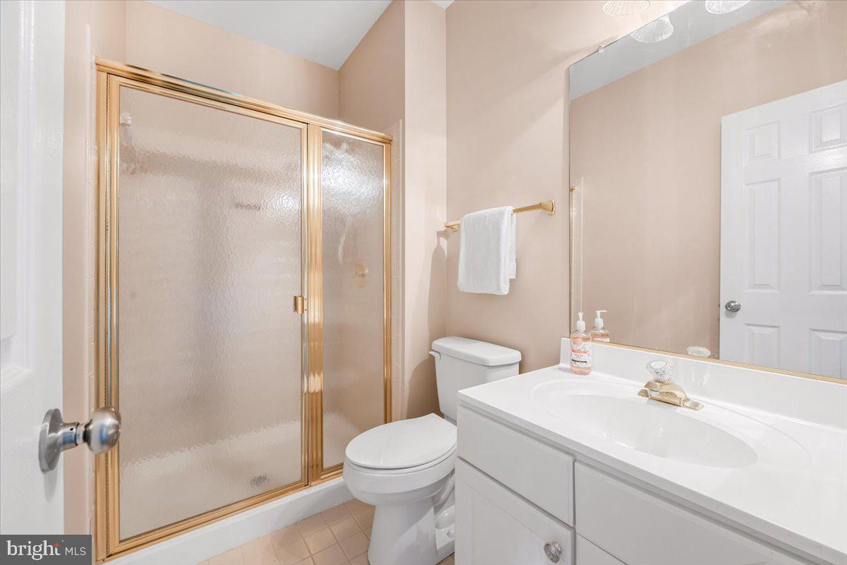 12664 Granite Ridge Drive North Potomac, MD 20878 - Photo 33 of 37 a bathroom with a sink toilet and shower
